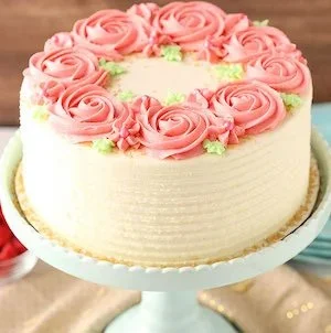 Decadent Chocolate Covered Strawberry Cheesecake topped with fresh strawberries and chocolate drizzle.