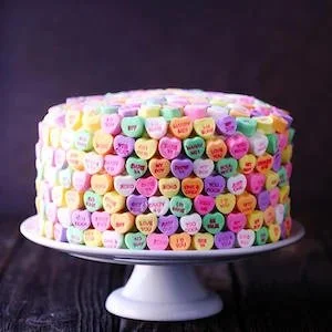 Deliciously layered French Strawberry Cake topped with fresh strawberries