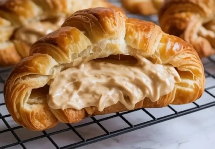 Delicious almond croissant filled with creamy almond paste and topped with almonds.