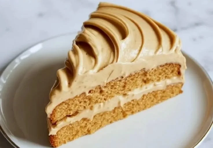 Delicious brown butter frosting on a cupcake with sprinkles.