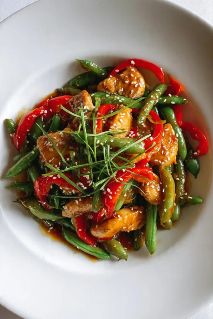 Delicious chicken and snap pea stir fry served in a colorful bowl