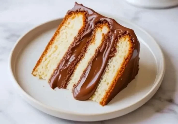Delicious Nutella cake filling spread between layers of moist cake