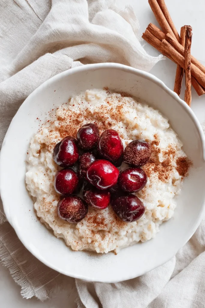 Delicious pressure-cooker cherry and spice rice pudding served in a bowl.