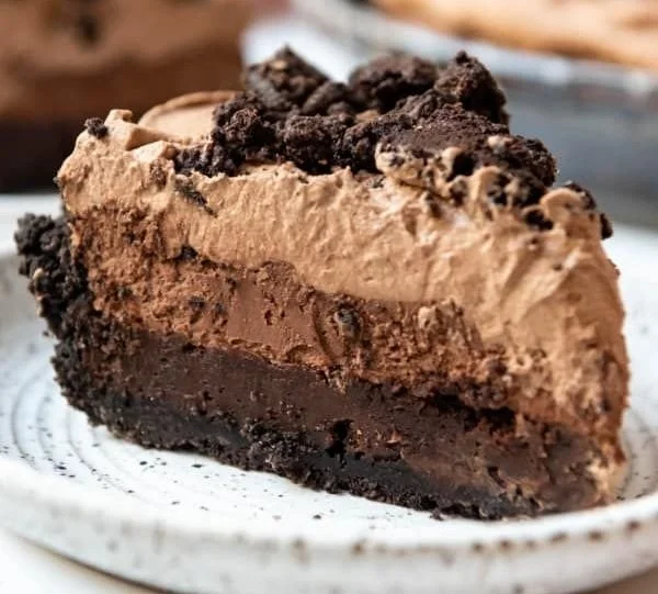 Delicious slice of Mississippi Mud Pie topped with chocolate and whipped cream