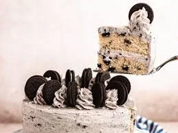 Delicious slices of Cookies and Cream Cake with chocolate cookie crumbs