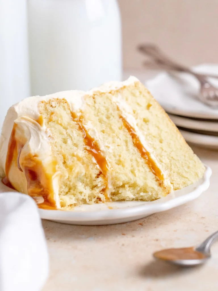 Delicious salted caramel cake topped with sea salt and caramel drizzle