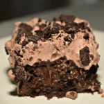 Delicious dirt cake dessert with chocolate layers and gummy worms