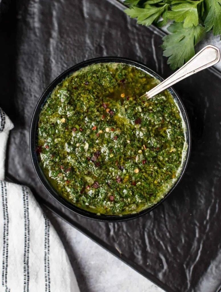 Bowl of easy homemade chimichurri sauce made with fresh herbs and garlic