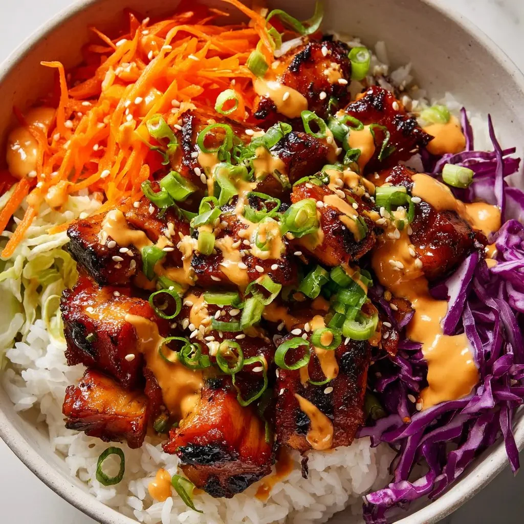 Easy Korean BBQ Chicken Bowls with spicy gochujang cream sauce.