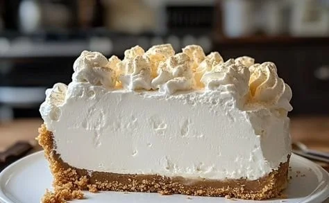 Delicious Marshmallow Whip Cheesecake topped with fluffy marshmallow cream.