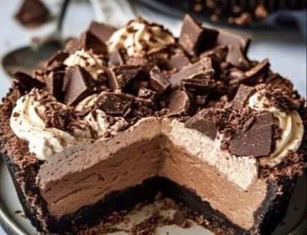 Delicious Mississippi Mud Pie topped with chocolate and marshmallows.