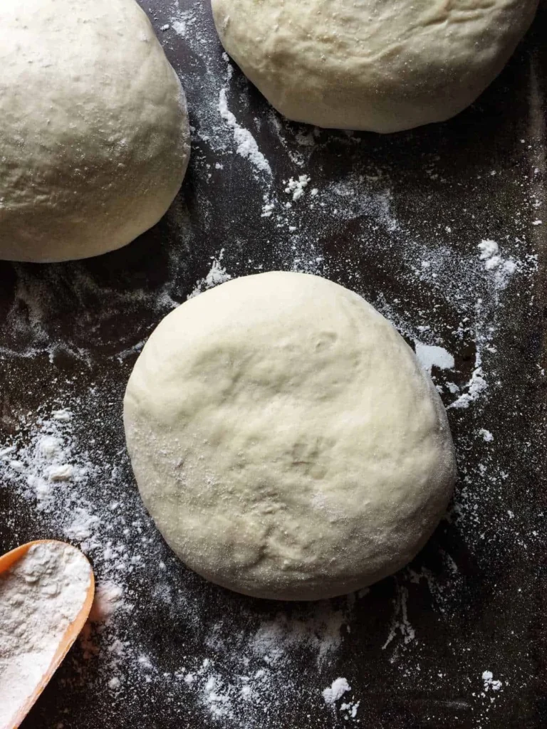 Freshly prepared pizza dough ready for toppings