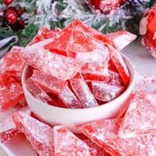 Red Hot Cinnamon Hard Candy in a clear bowl, featuring vibrant red sweets.