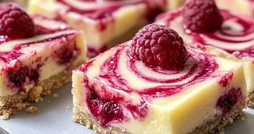 Delicious lemon raspberry swirl bars with a vibrant swirl pattern.
