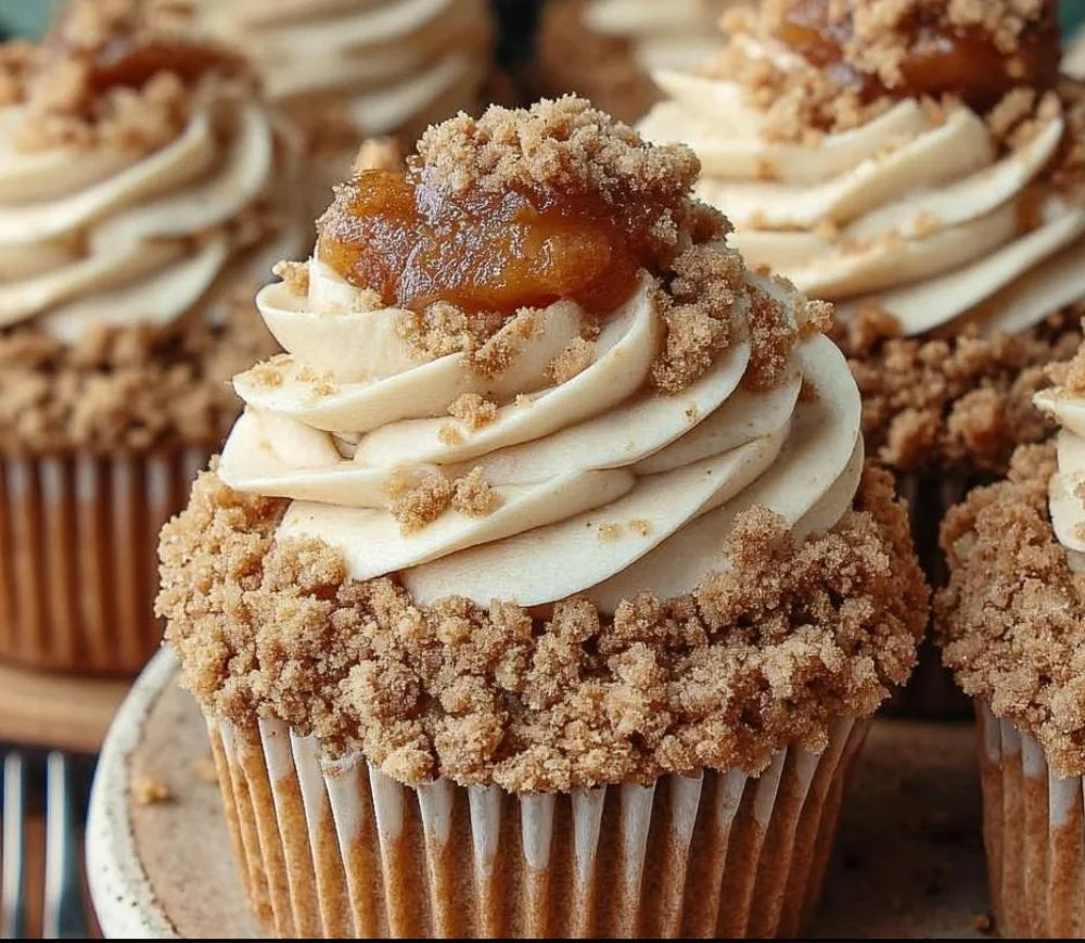 Apple Crumble Cupcakes topped with crumble and caramel drizzle