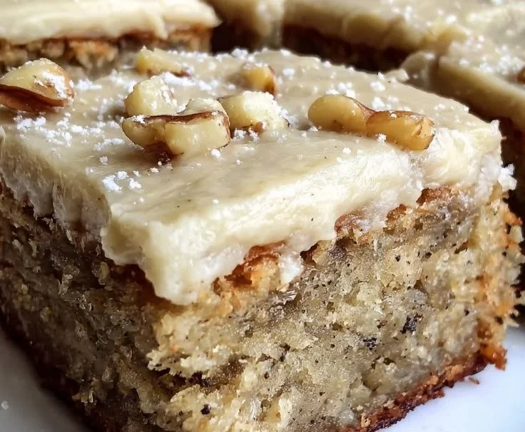 Delicious banana bread brownies with brown butter frosting on a plate
