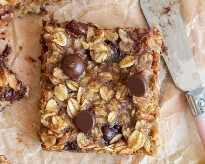 Baked banana oatmeal bars with oats and bananas, a healthy snack option.