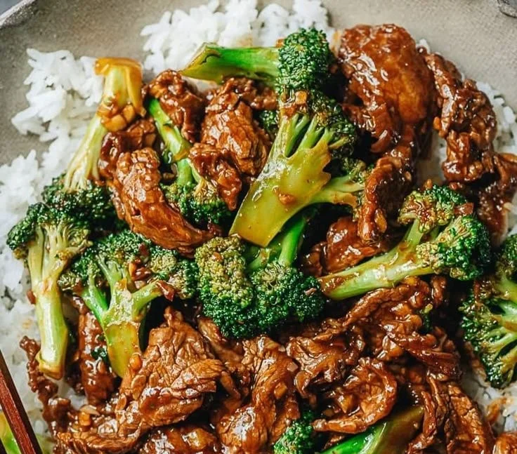Delicious Beef with Broccoli stir-fry served in a bowl with chopsticks