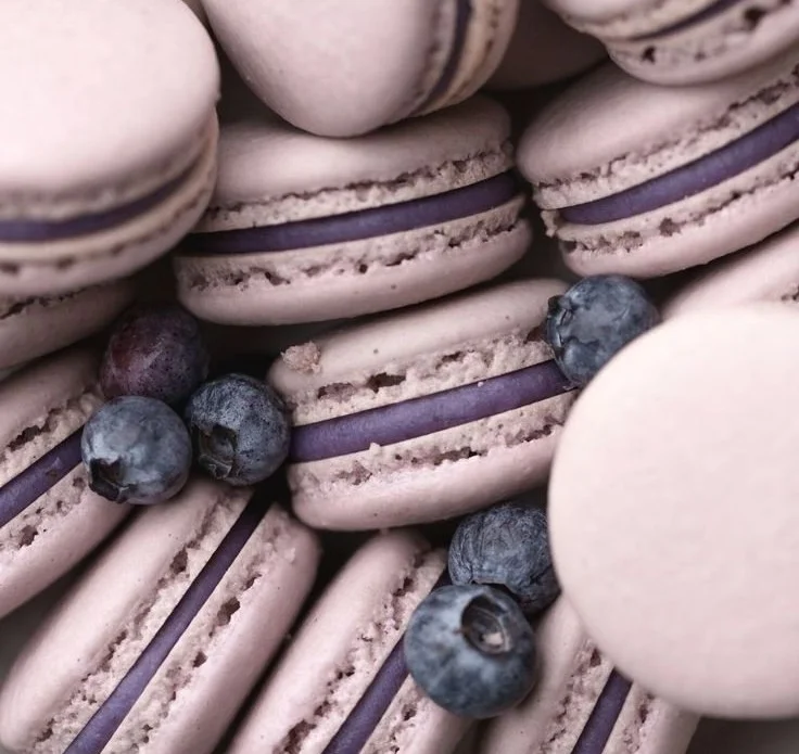 A plate of delightful blueberry macarons with a soft filling