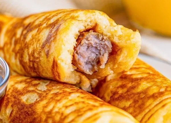 Delicious Breakfast Pigs in a Blanket served on a plate