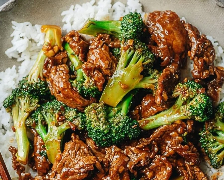 Chinese Beef and Broccoli served in a pan with vegetables