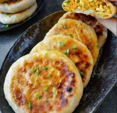Chinese-style savoury stuffed breakfast pancakes on a plate