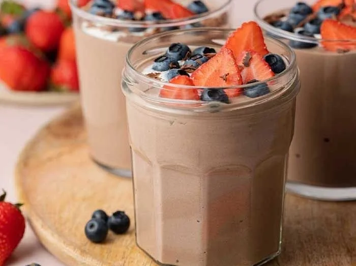 Delicious Chocolate Protein Pudding in a bowl topped with chocolate shavings.