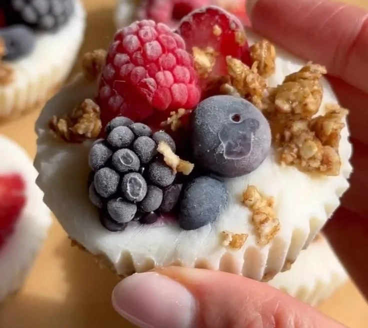 Creamy frozen yogurt cups with assorted toppings for a delicious dessert