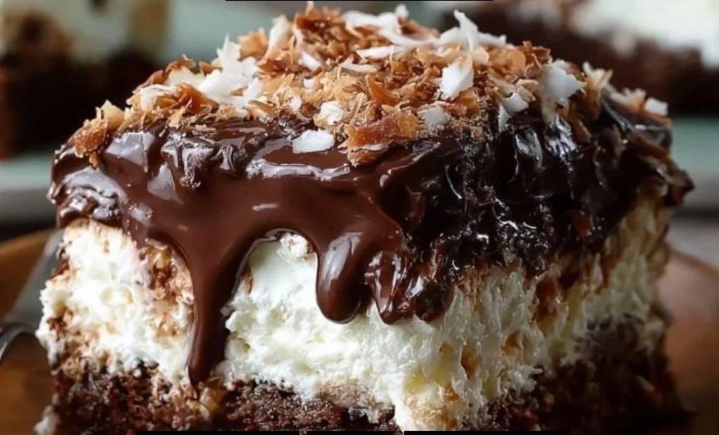 Delicious easy chocolate coconut poke cake topped with coconut flakes