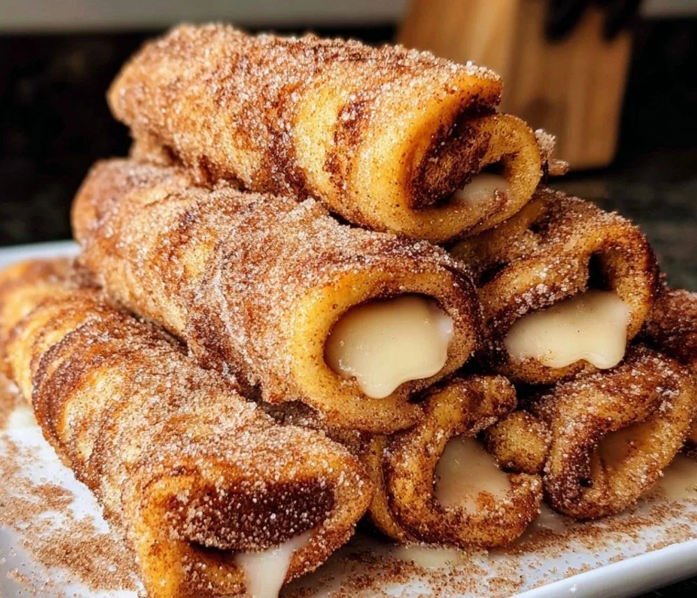 Delicious easy cinnamon French toast roll-ups served with syrup and berries