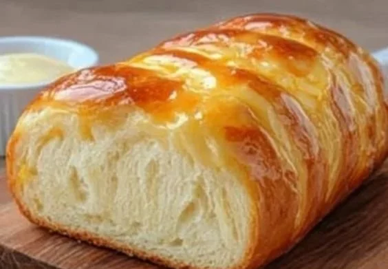 Homemade easy sweet condensed milk bread on a wooden table