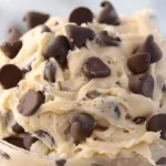 Bowl of Greek yogurt cookie dough with chocolate chips and a spoon