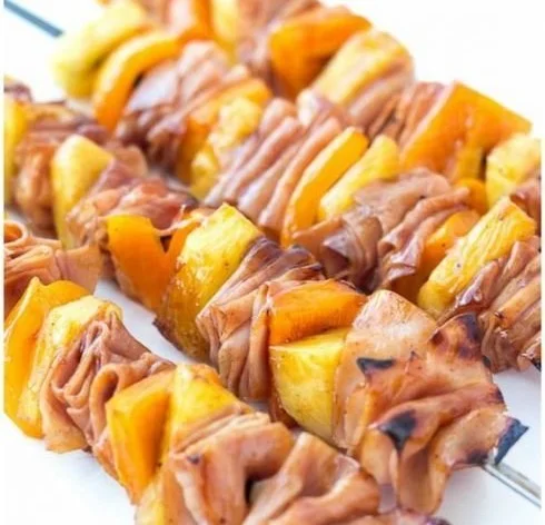 Hawaiian ham and pineapple skewers served on a platter