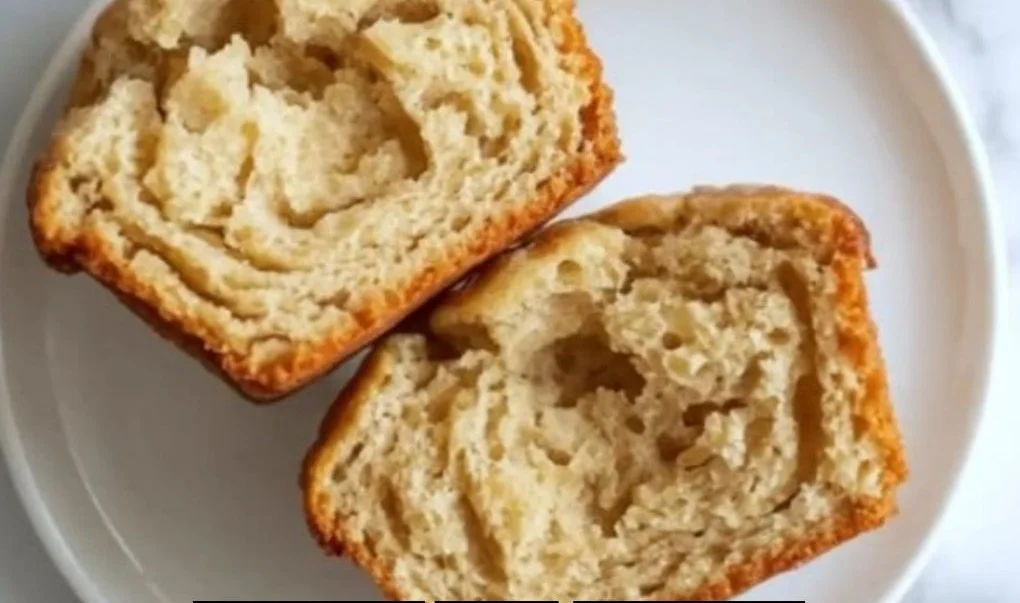 Healthy almond flour muffins on a wooden table with fresh fruit