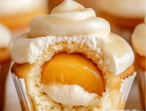 Honey peach cream cheese cupcakes with a soft texture and vibrant peach topping