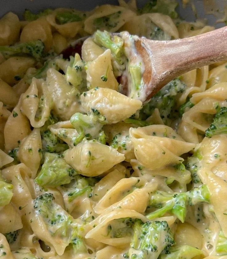 One-pot broccoli mac and cheese dish garnished with fresh herbs