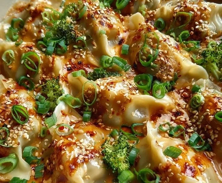 Delicious oven-baked dumplings served with a creamy peanut sauce