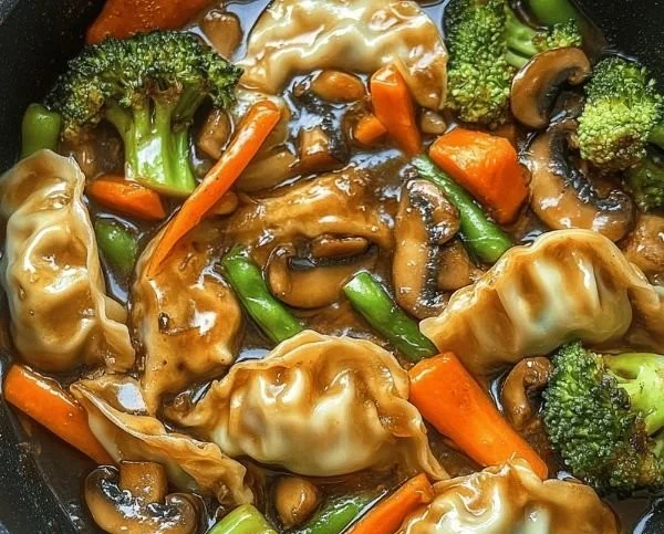 Delicious quick potsticker stir fry with fresh vegetables in a skillet.