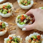A plate of colorful sushi cups filled with fresh ingredients.