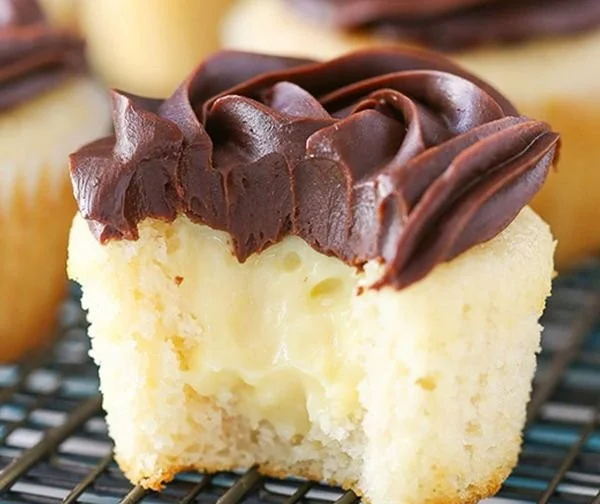 Boston Cream Pie cupcake topped with chocolate glaze and cream filling