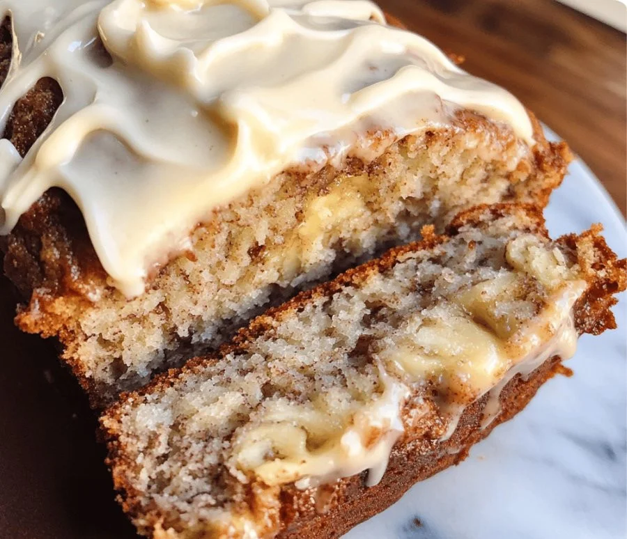 Delicious cinnamon roll banana bread with gooey cinnamon swirl topping