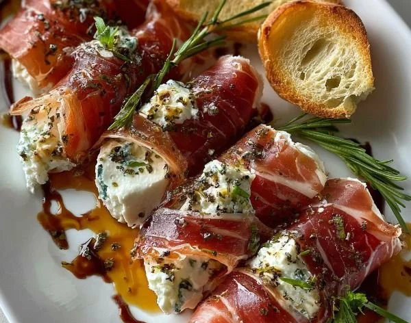 Crispy prosciutto appetizer with Boursin cheese and honey on a plate