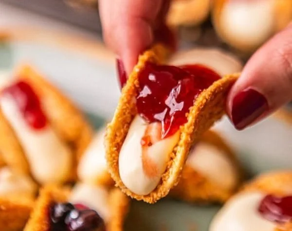 Delicious dessert tacos filled with chocolate, fruits, and sweet cream