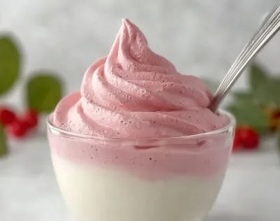 Delicious Fluffy Jello Whip served in a bowl, showcasing its airy texture.