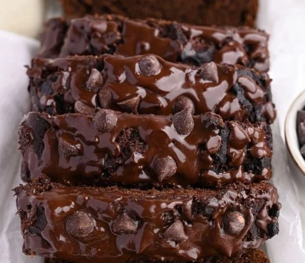 High-protein chocolate banana bread slice with chocolate chips and banana