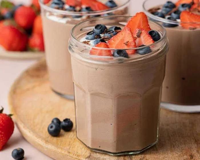 High-protein chocolate pudding served in a bowl with a spoon