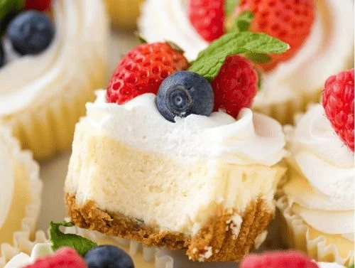 Delicious mini cheesecakes topped with fresh fruits on a serving platter