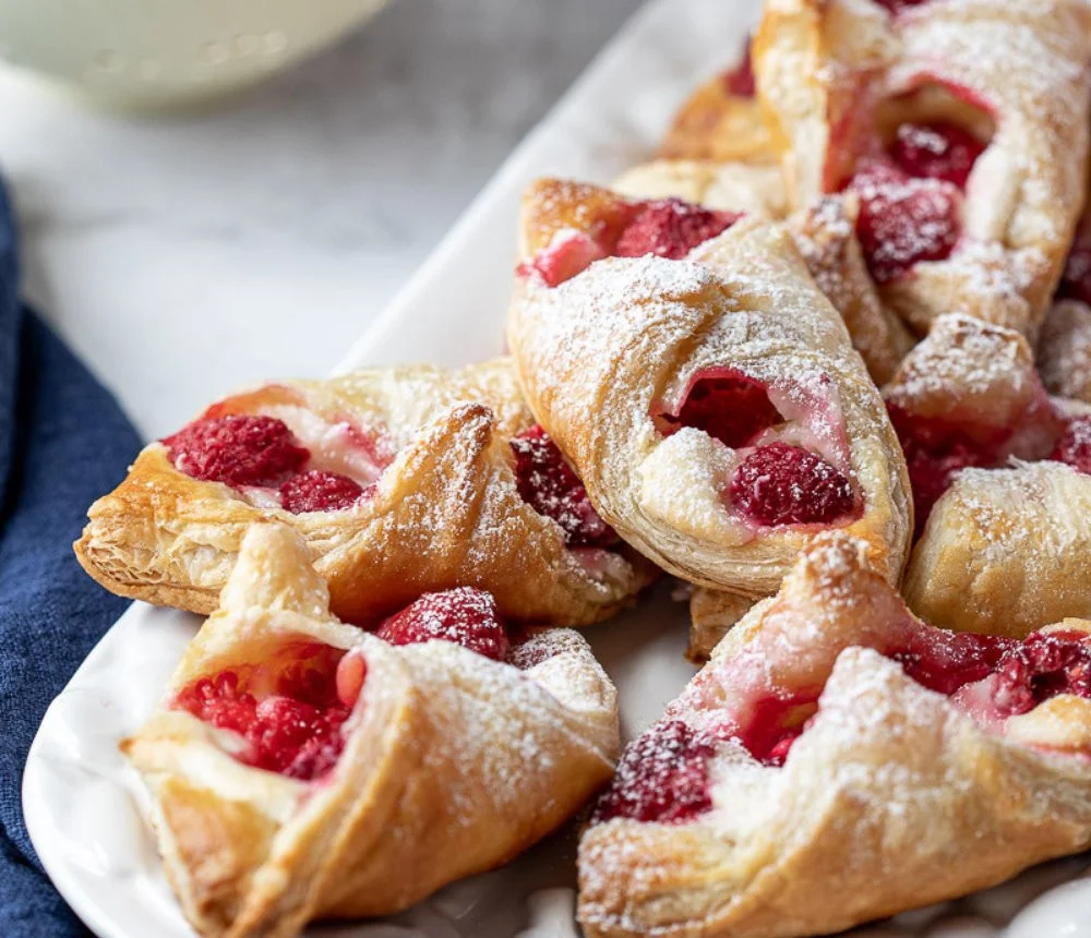 Freshly baked Raspberry Danish Pastry made with flaky puff pastry