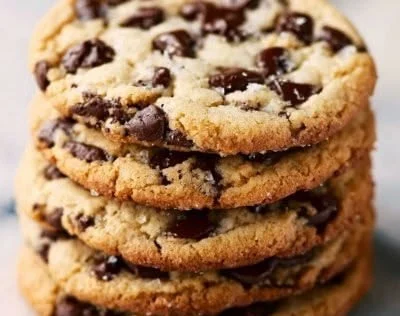 Delicious Texas cowboy cookies with oats, chocolate chips, and nuts on a wooden table