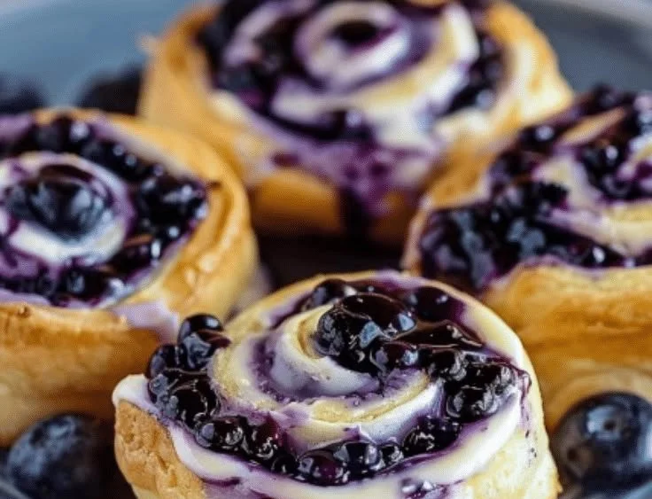 Delicious blueberry cheesecake rolls with a swirl of cheesecake and blueberry filling